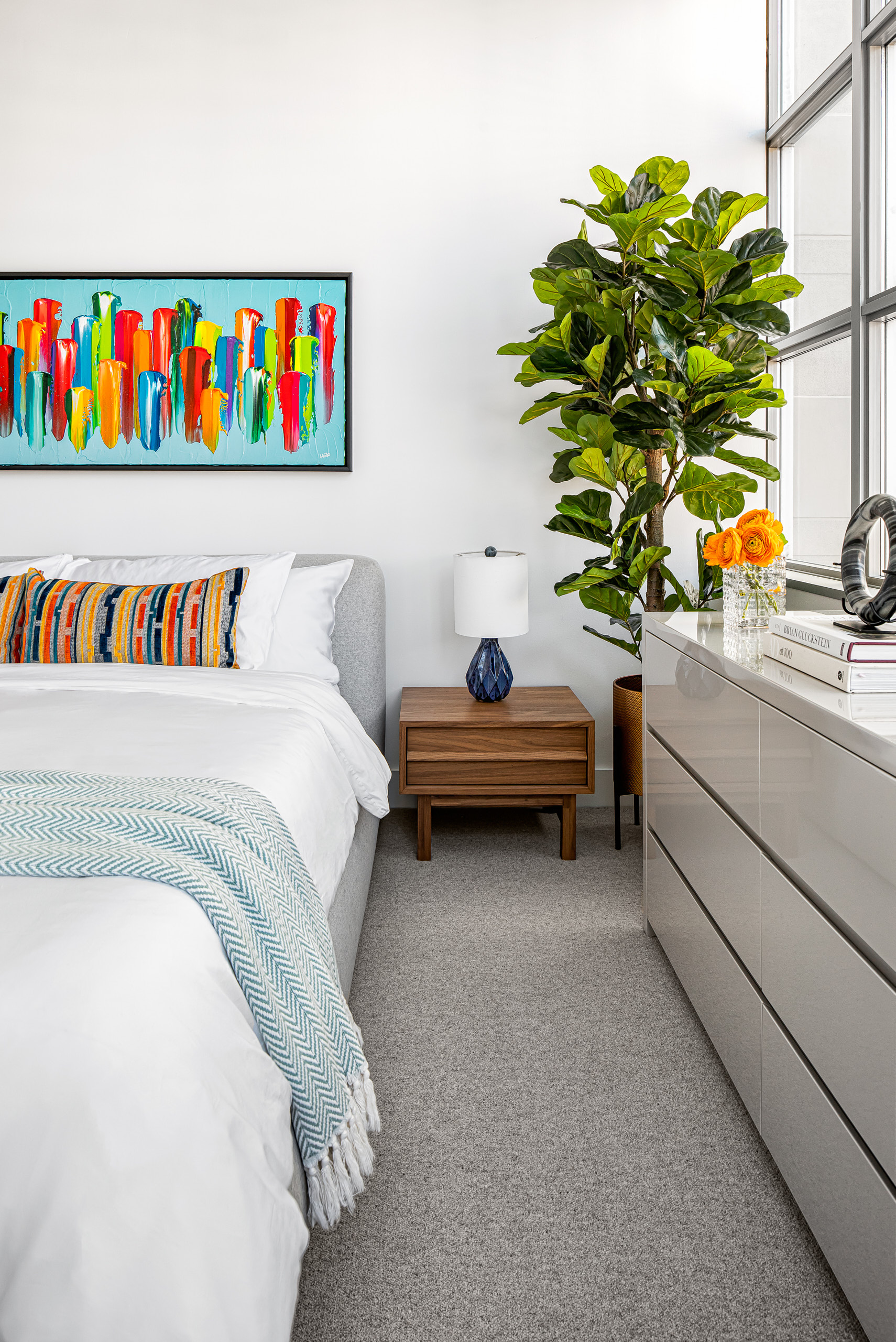 Industrial style primary bedroom design with exposed elements
