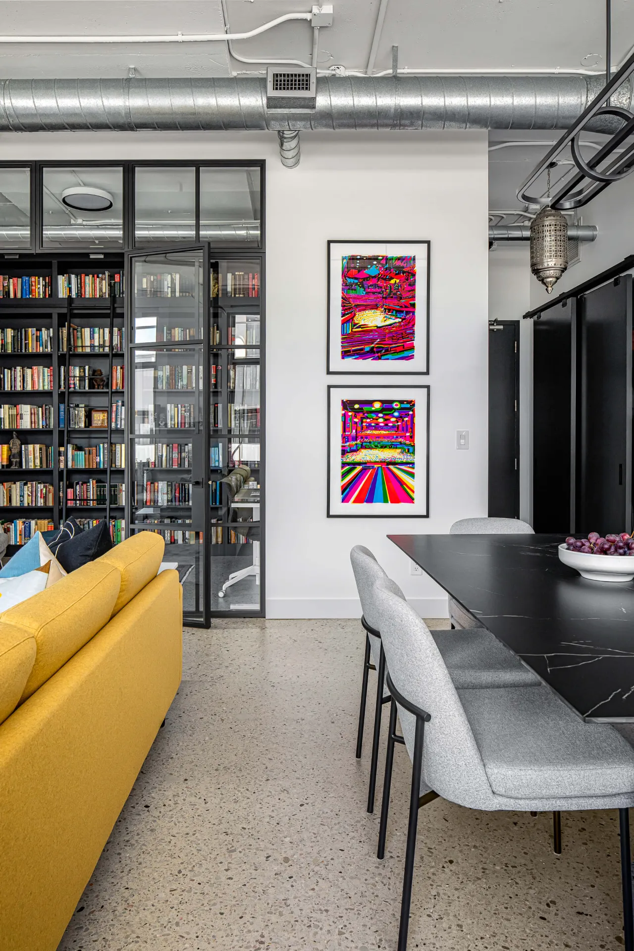 Colorful art prints displayed on living room wall