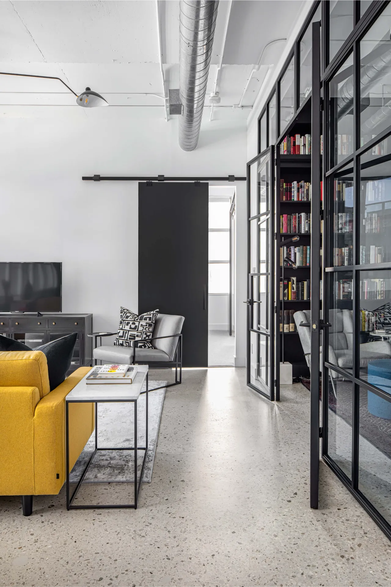 Custom glass and metal doors leading to home library