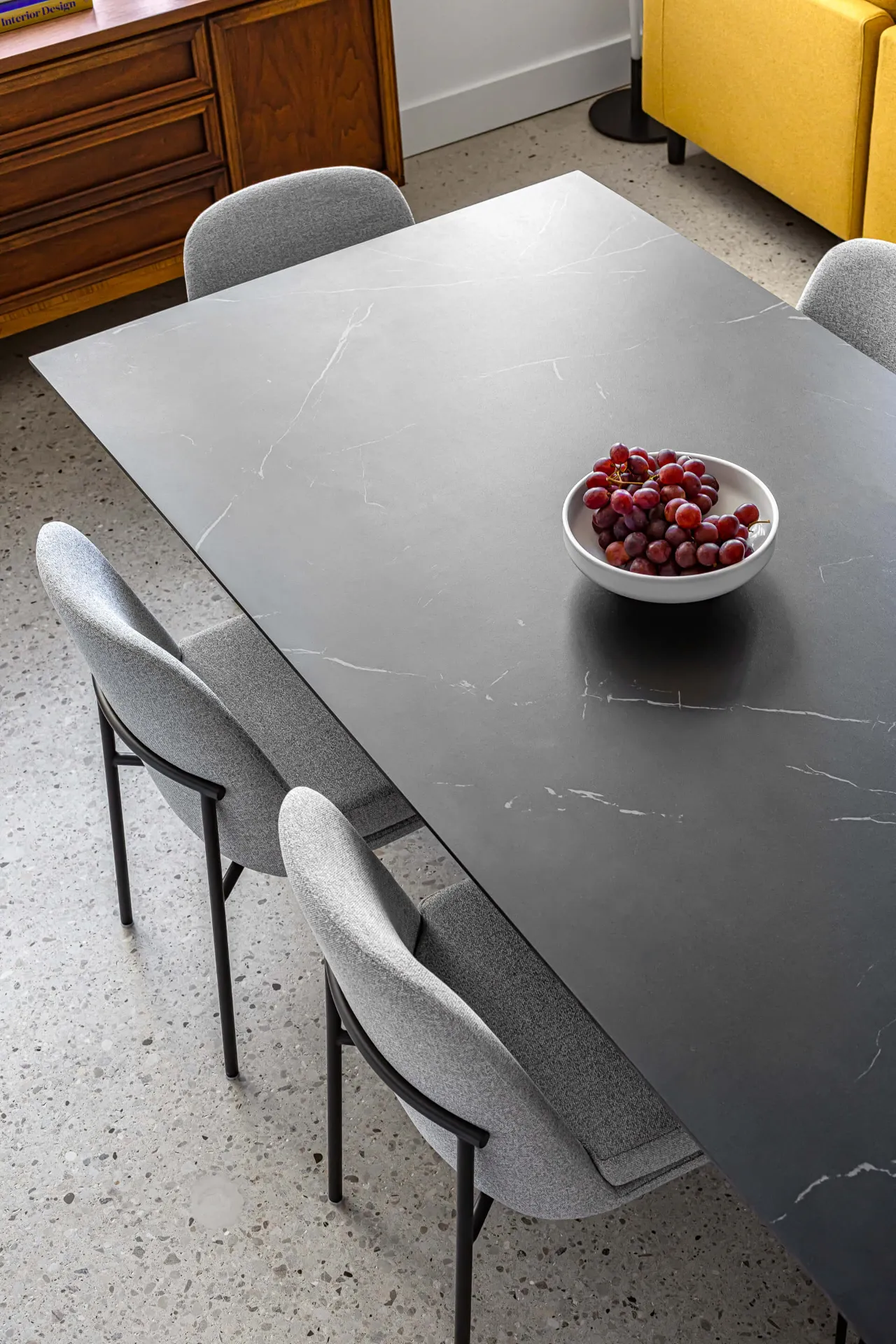 Close up of dining table surface showing natural stone veining