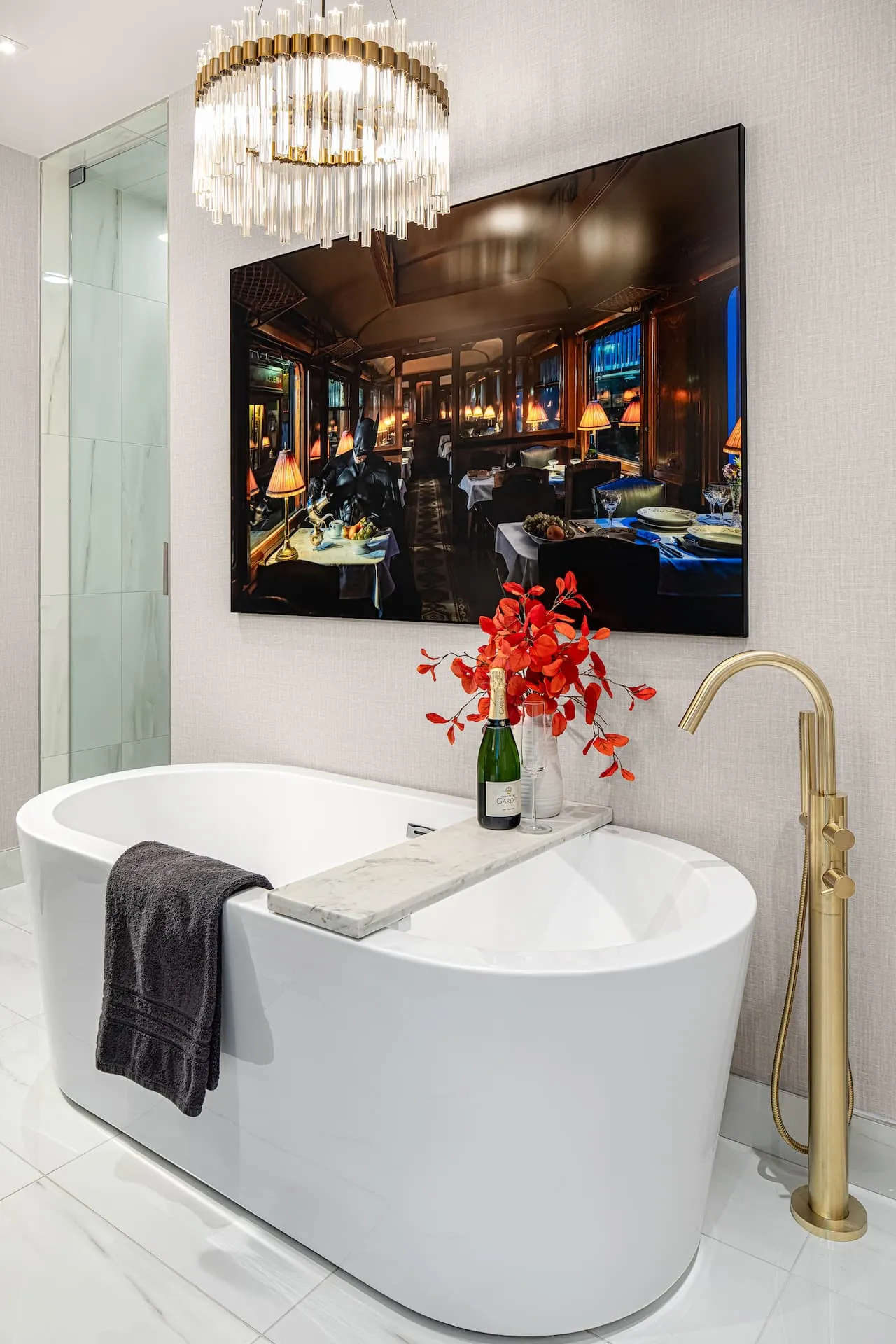 Luxurious spa ensuite featuring witty artwork of Batman pouring tea on a train car