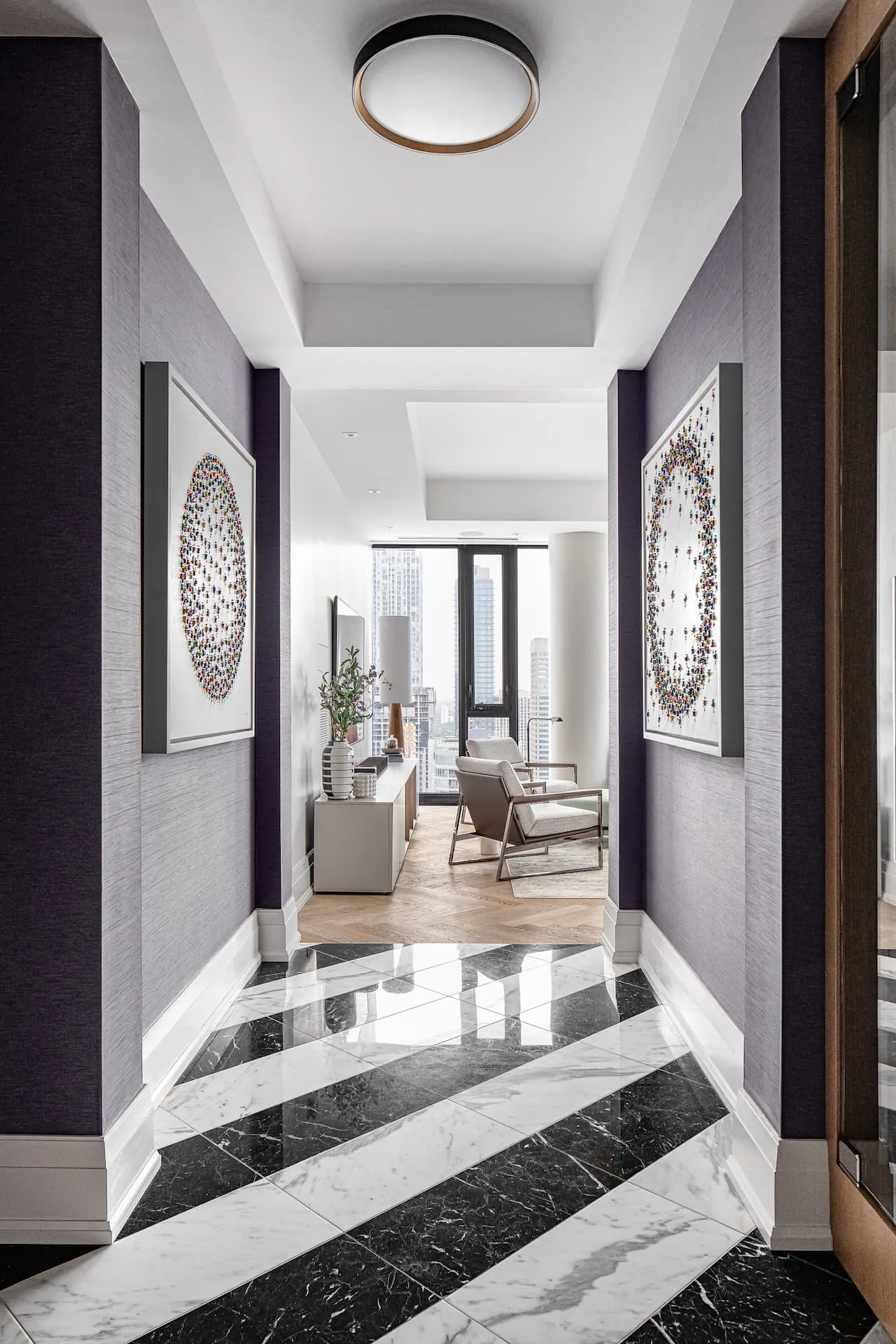 Jane Waterous original art hanging in a foyer with purple wallpaper