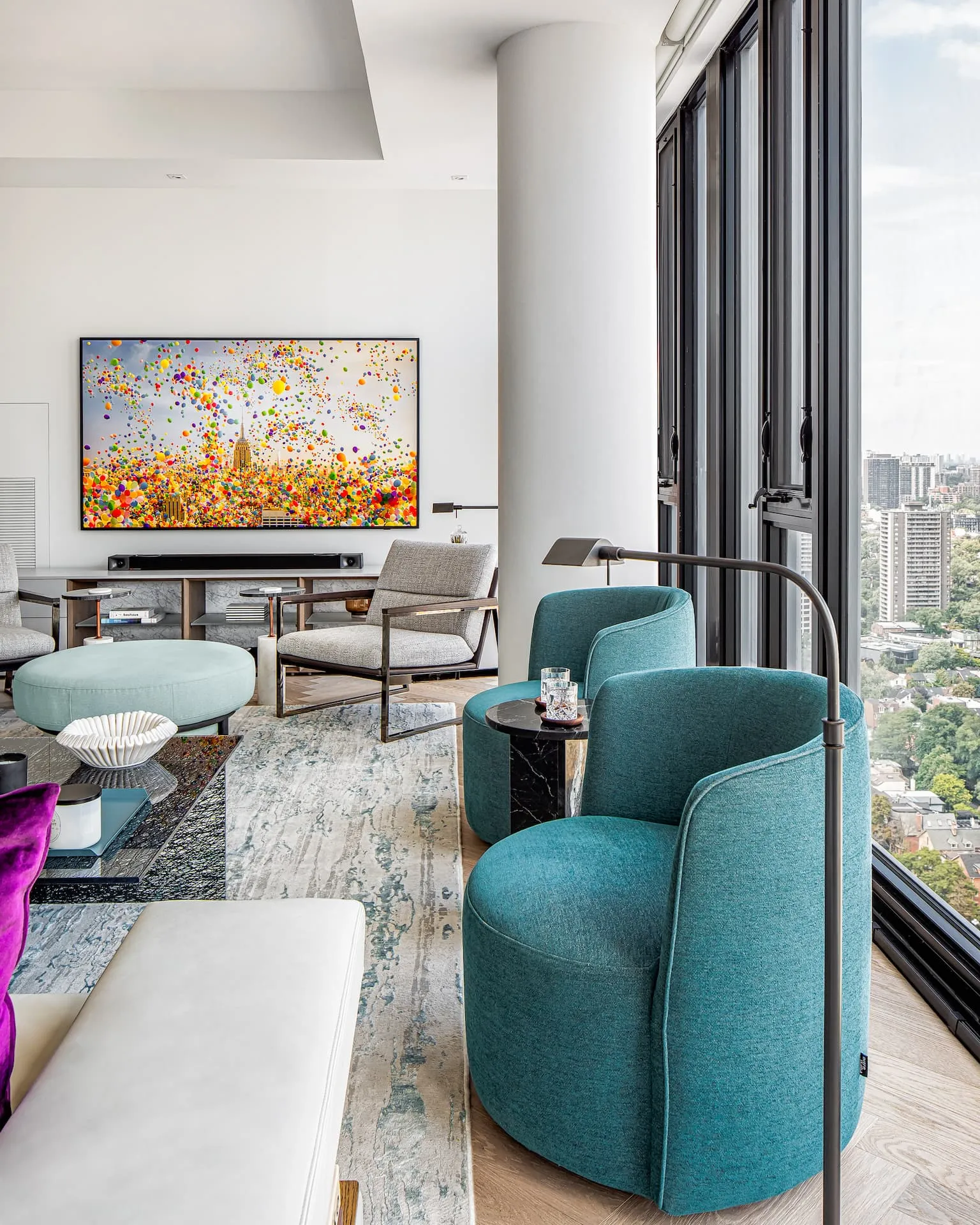 Enormous custom blue and grey rug anchoring a living space meant for entertaining