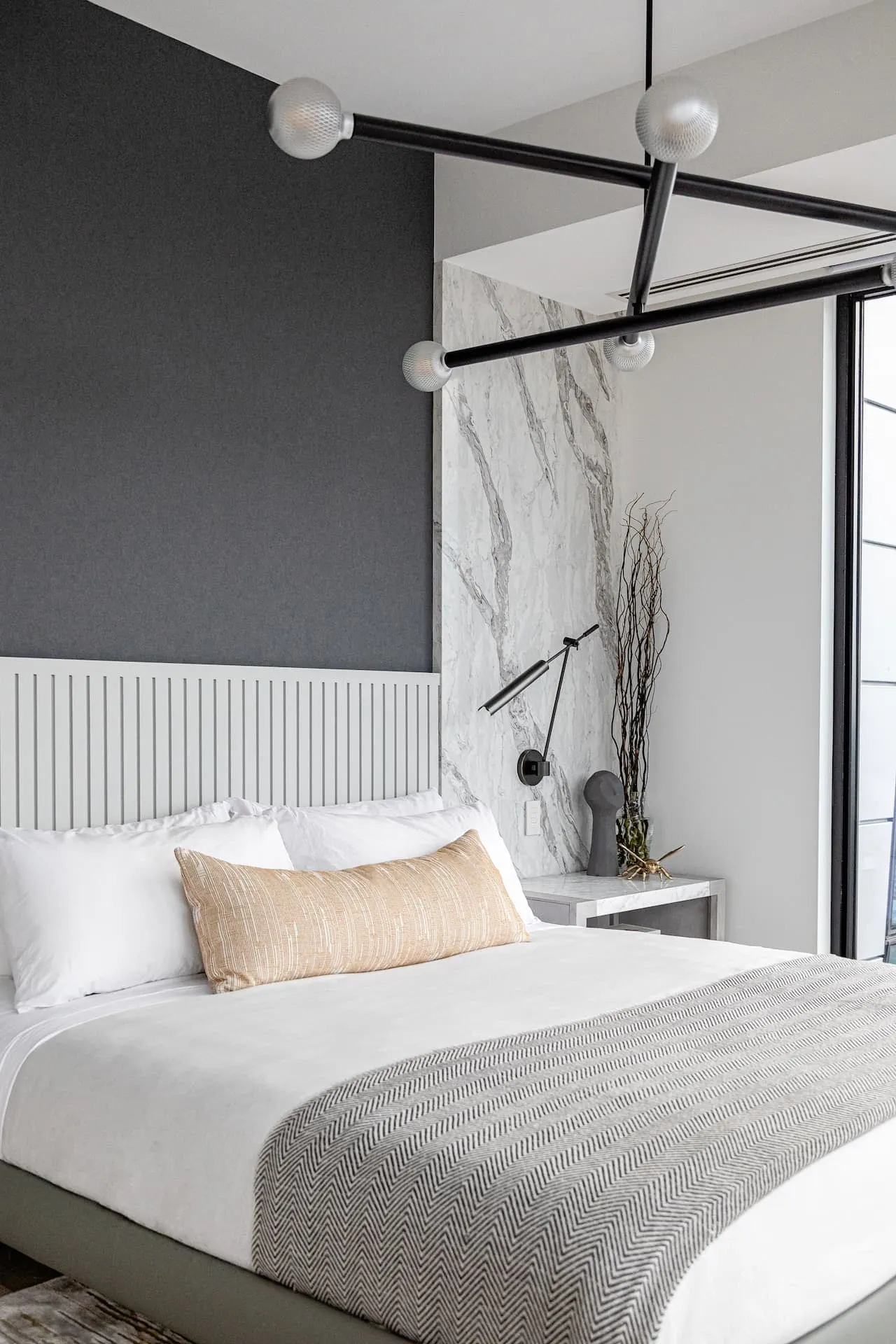 Grey fluted headboard with soft bedding in a serene Yorkville primary bedroom