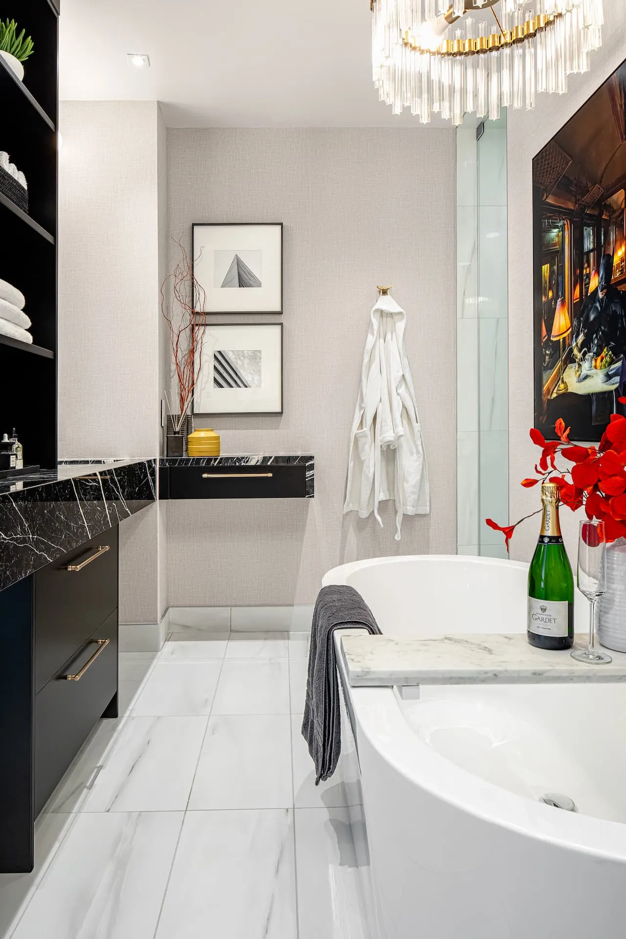 Luxurious spa ensuite with a freestanding tub and black marble vanity